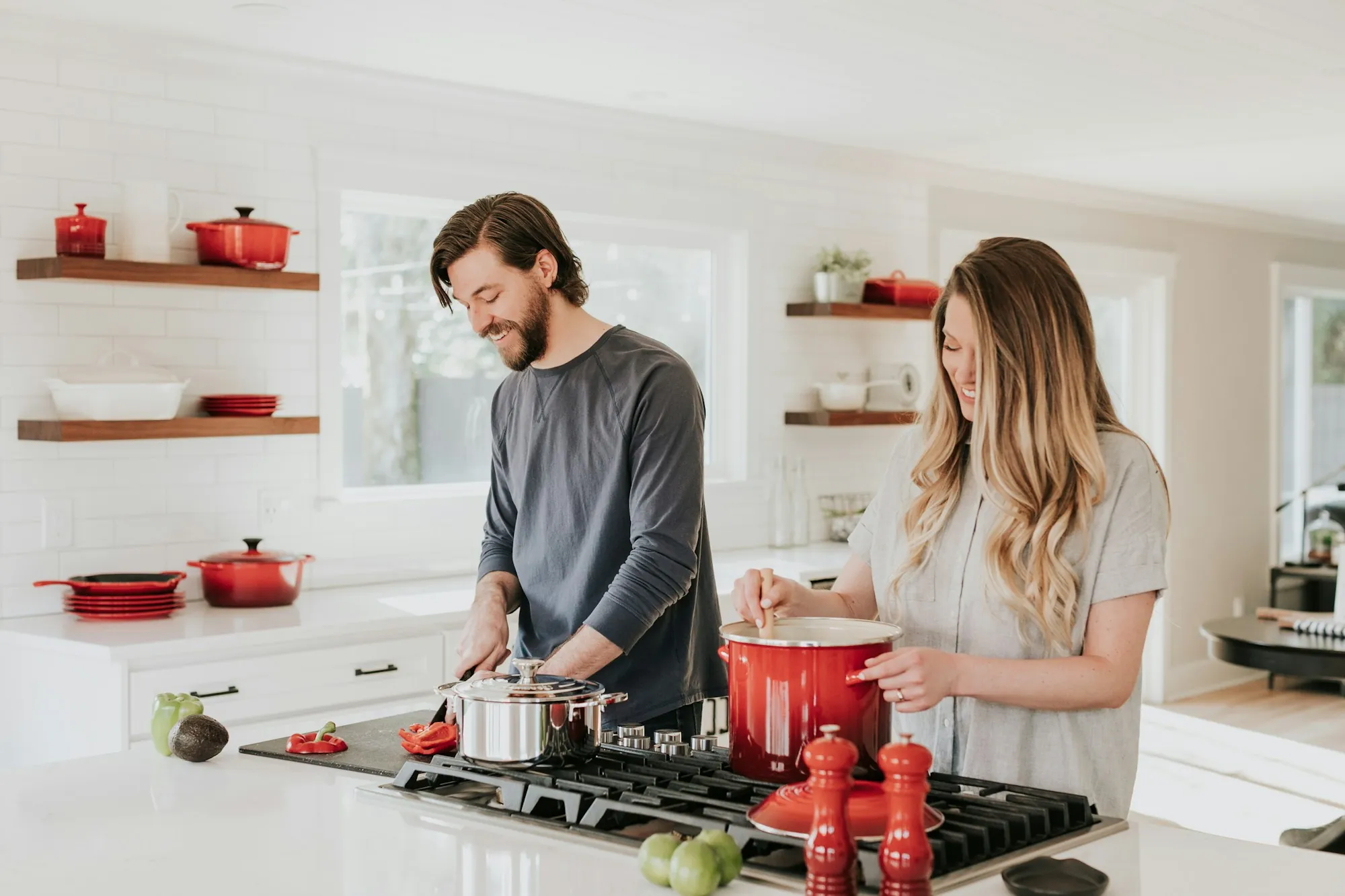Water filtration for Aliso Viejo homes Couple cooking together at a bright home kitchen counter